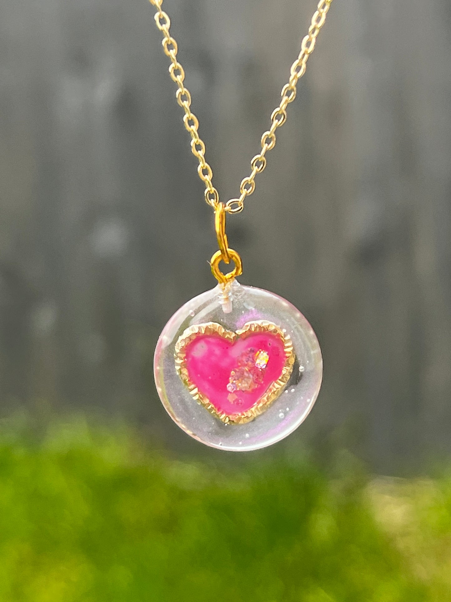 Golden ring and heart in round necklaces