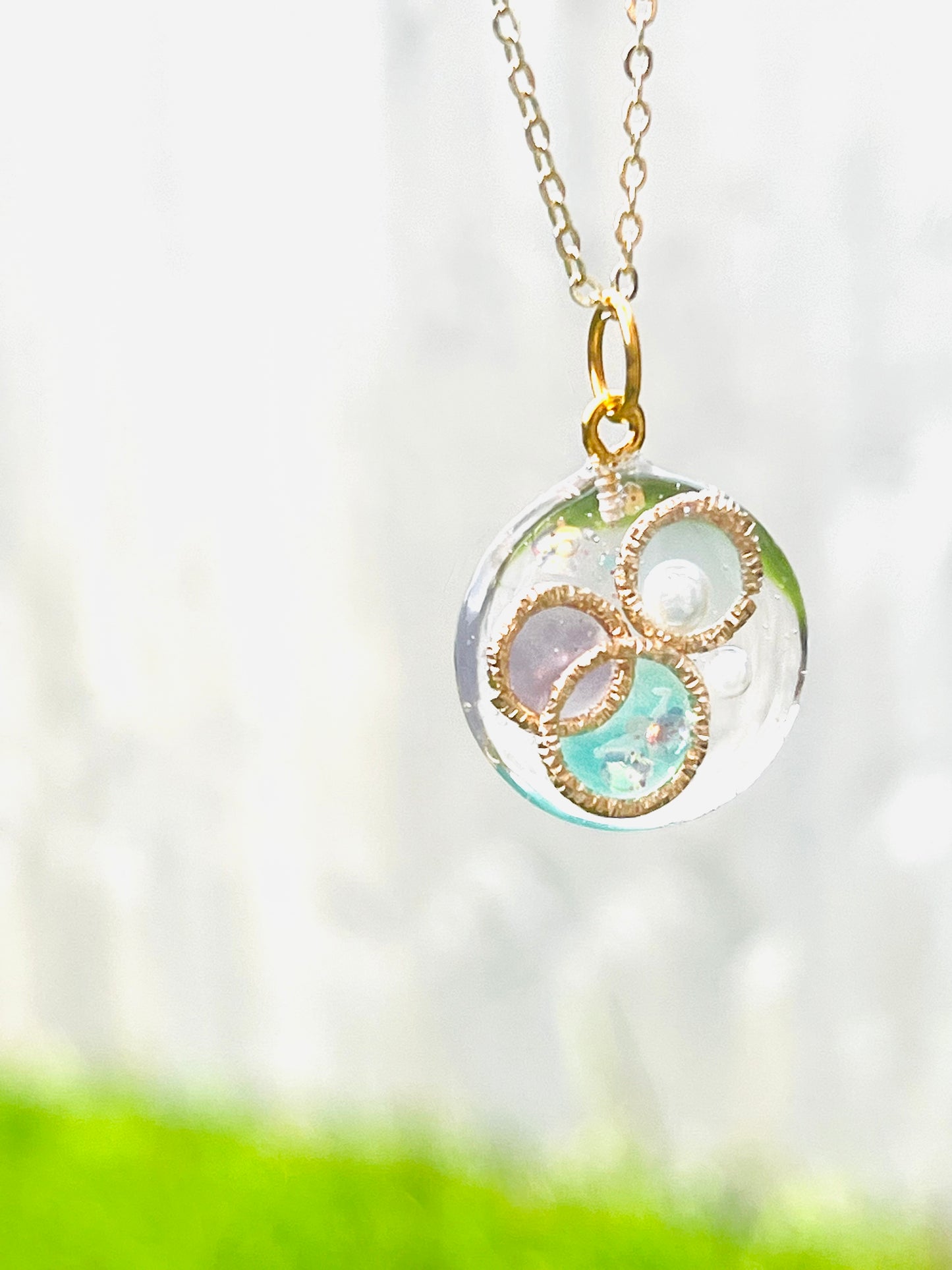 Golden ring and heart in round necklaces