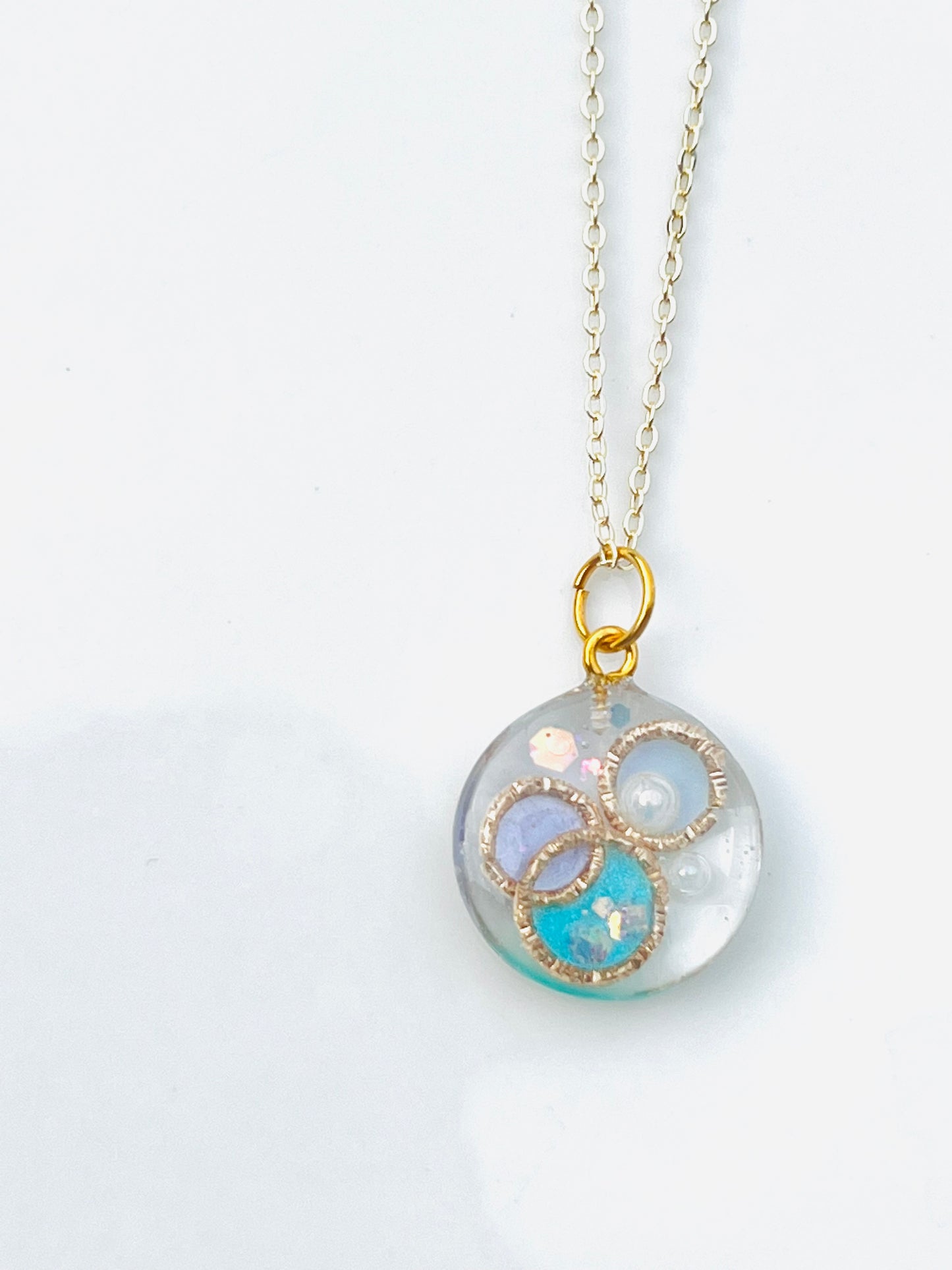 Golden ring and heart in round necklaces