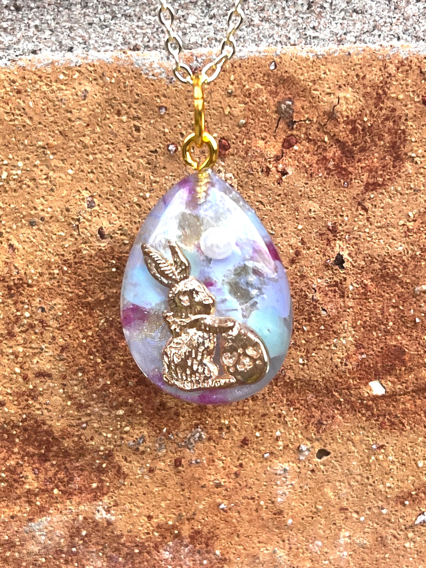 Golden rabbit with pearl necklace