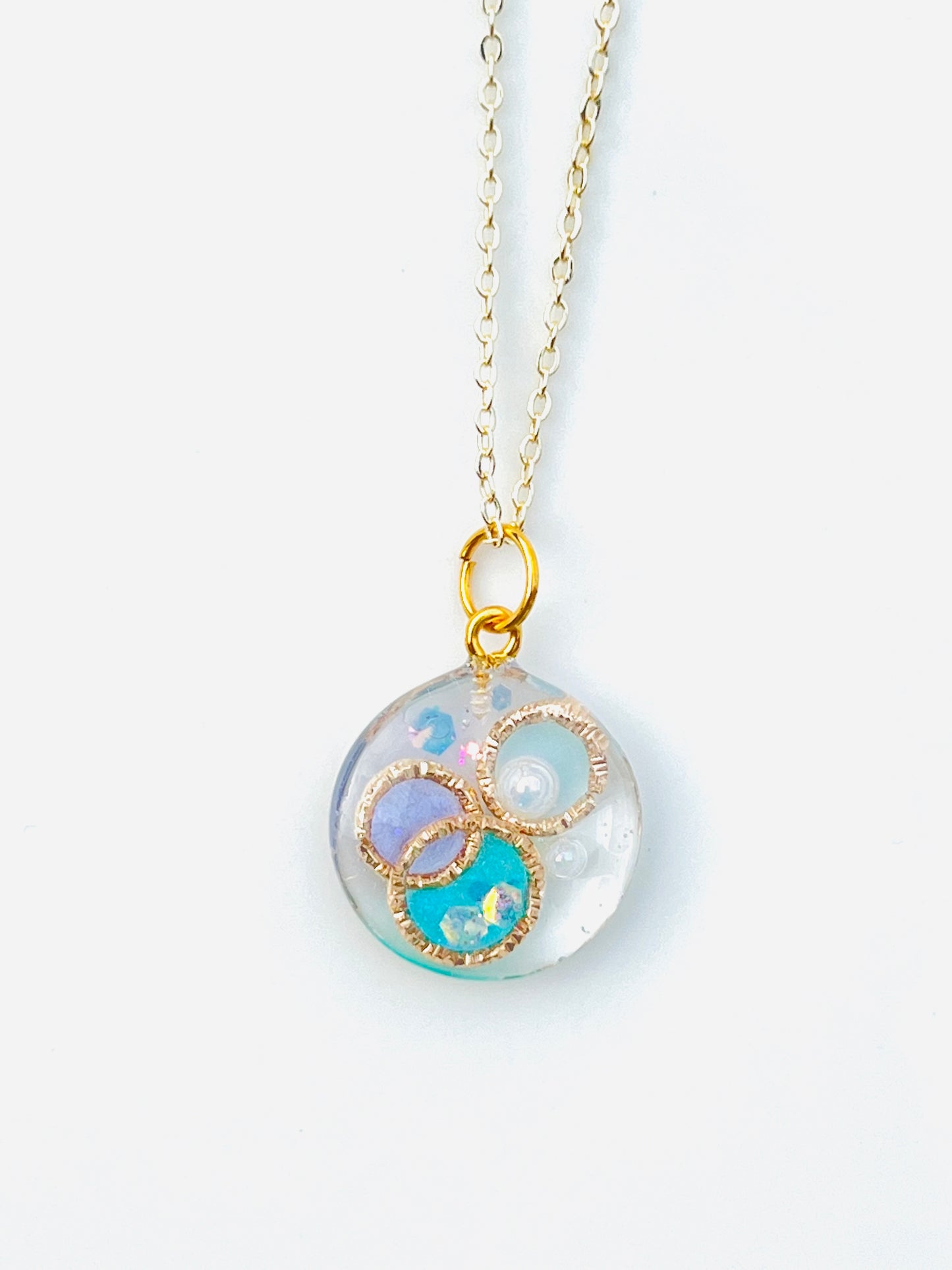 Golden ring and heart in round necklaces