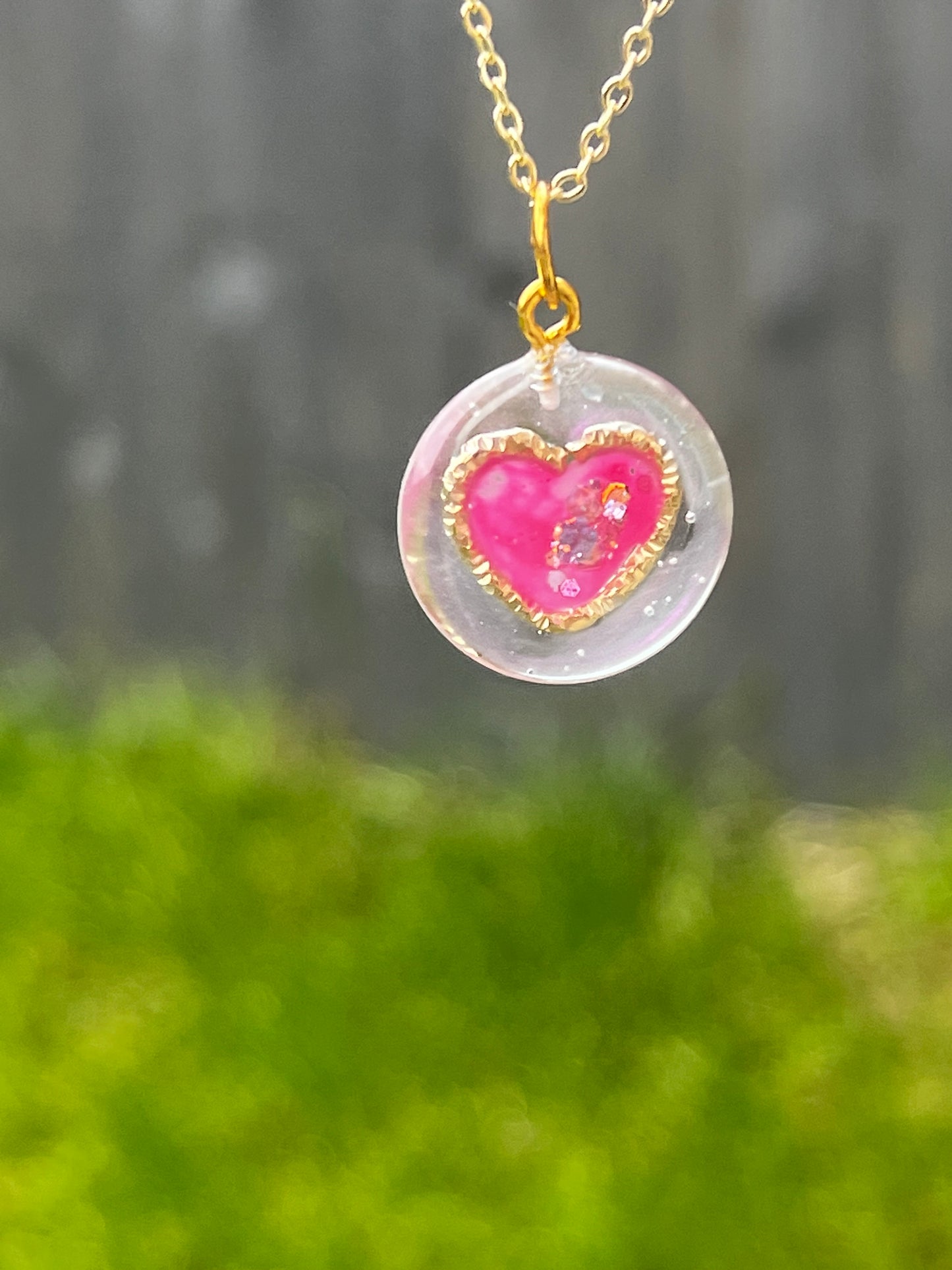 Golden ring and heart in round necklaces