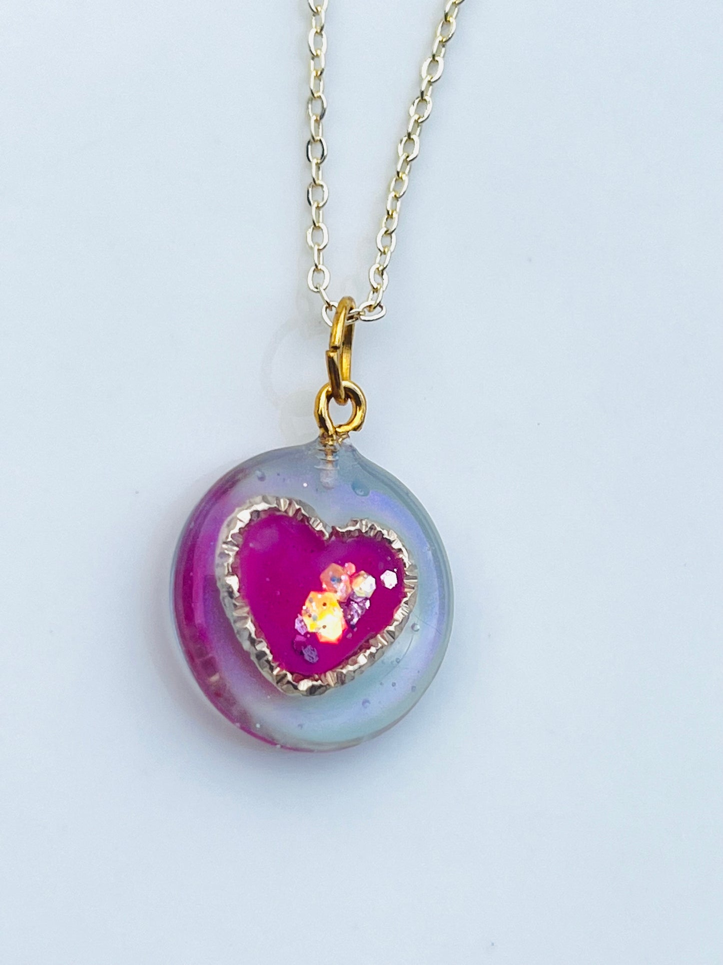 Golden ring and heart in round necklaces