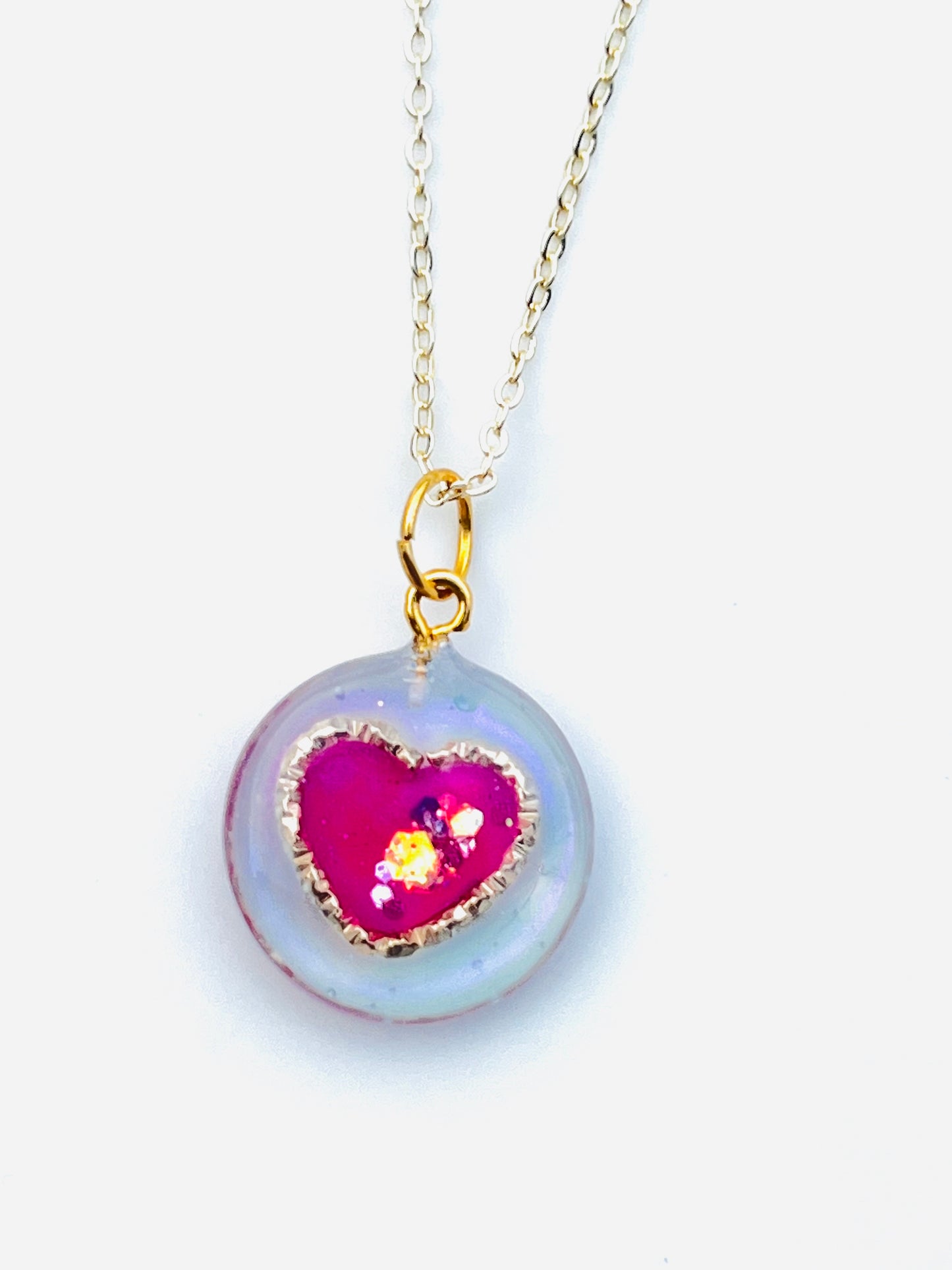 Golden ring and heart in round necklaces