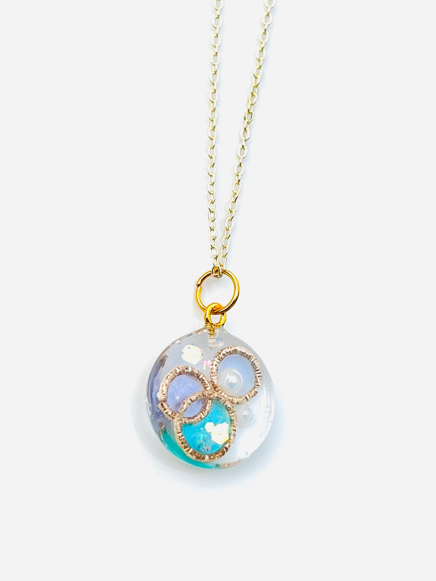 Golden ring and heart in round necklaces