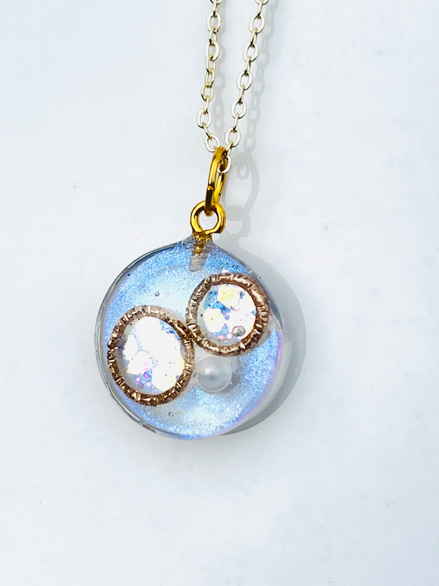 Golden ring and heart in round necklaces