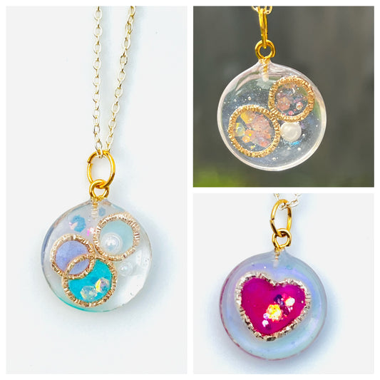 Golden ring and heart in round necklaces