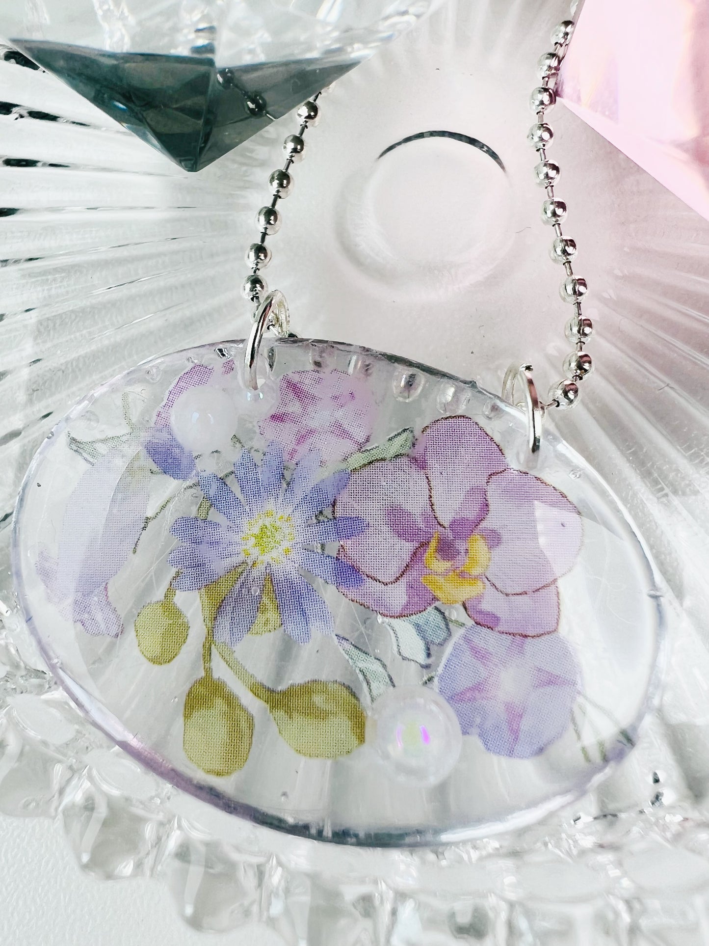 Purple flowers in oval necklace