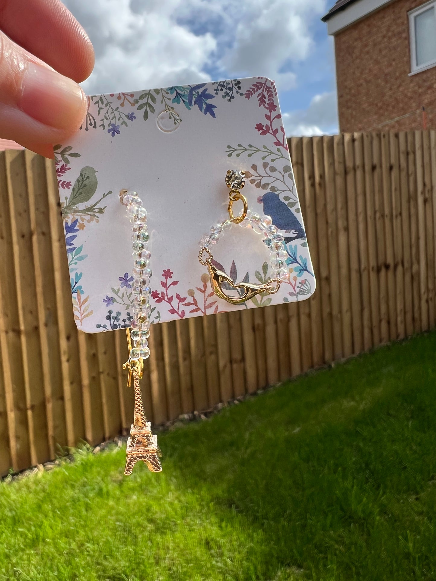 Golden Eiffel Tower and little crane earrings