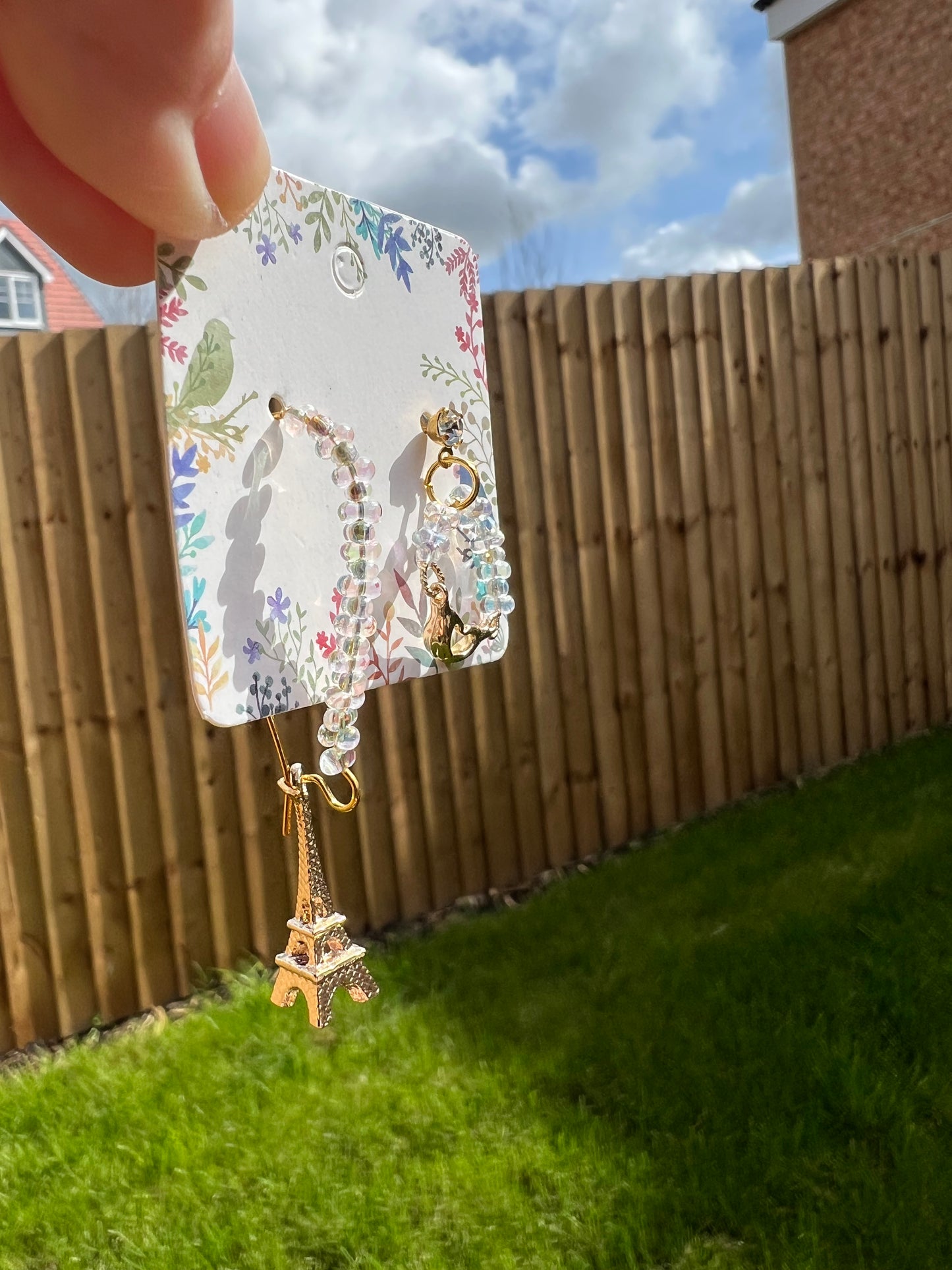 Golden Eiffel Tower and little crane earrings