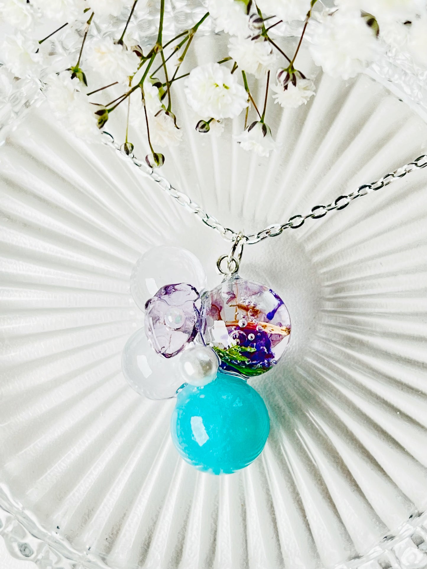 Sphere and flower necklaces