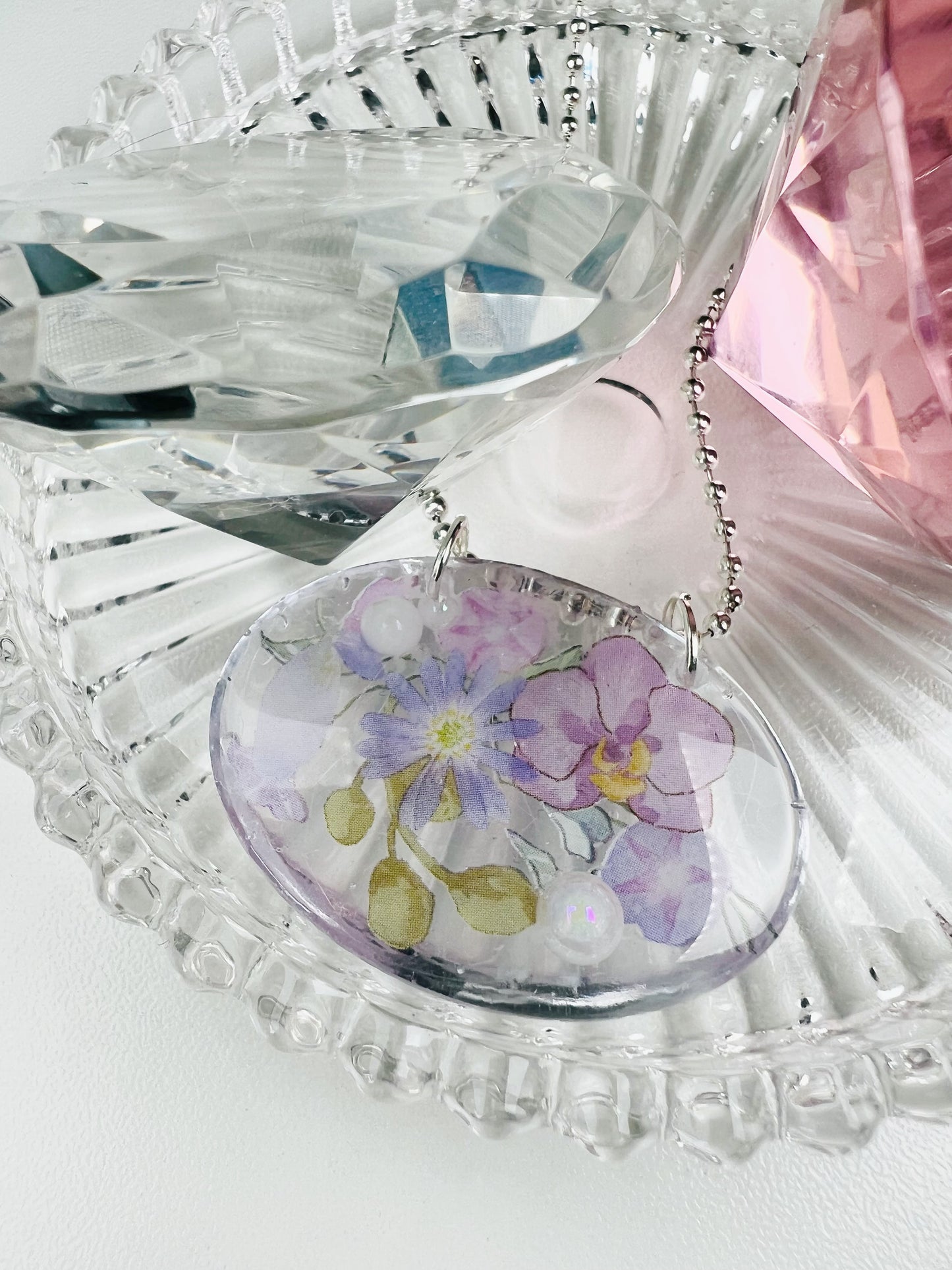 Purple flowers in oval necklace