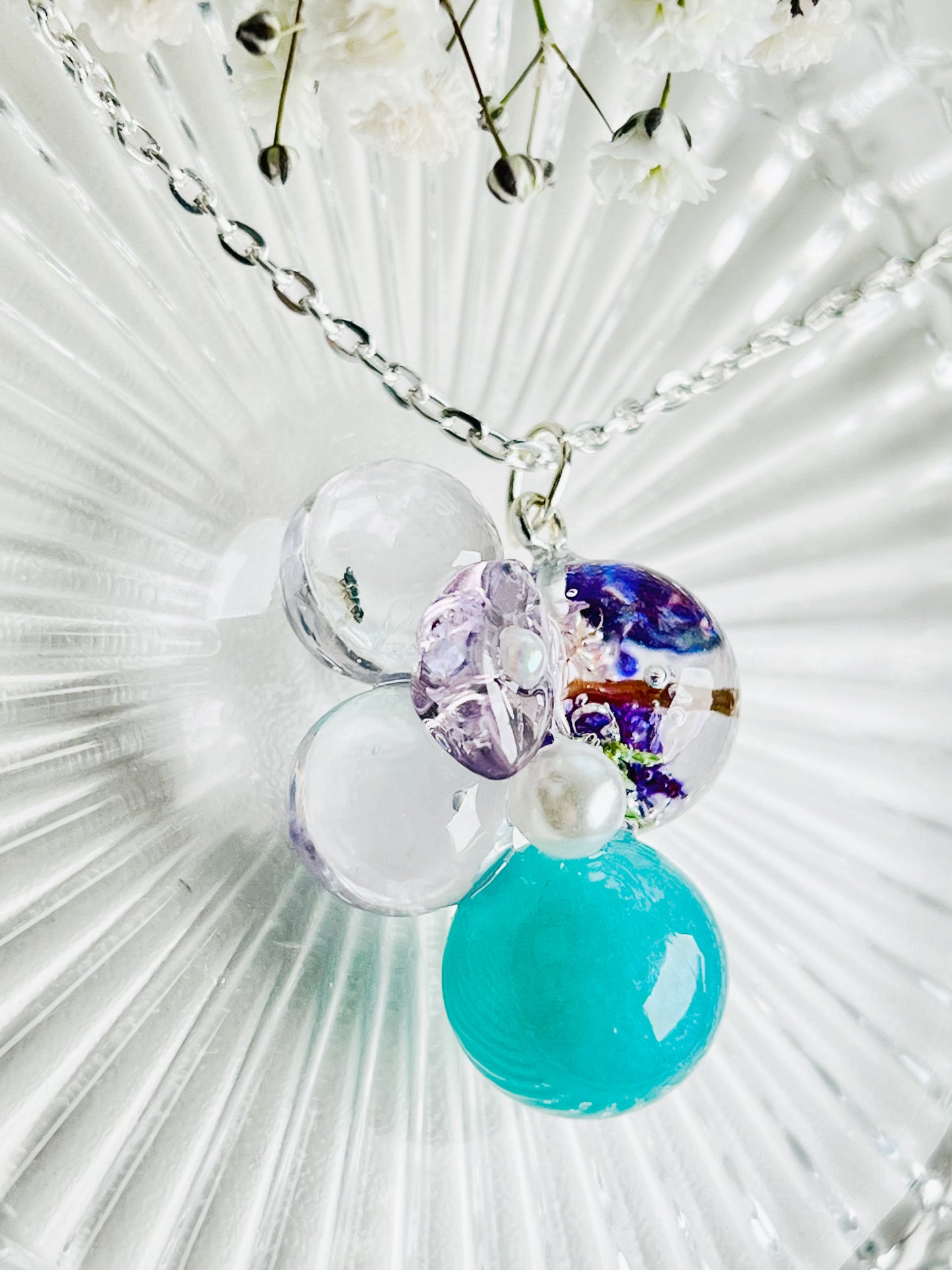 Sphere and flower necklaces